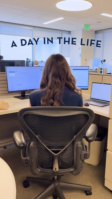 Boardwalk intern at her desk, from the "A Day in the Life" series