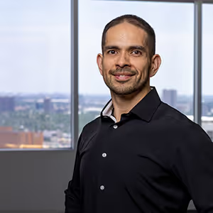 Boardwalk employee portrait in front of an office window